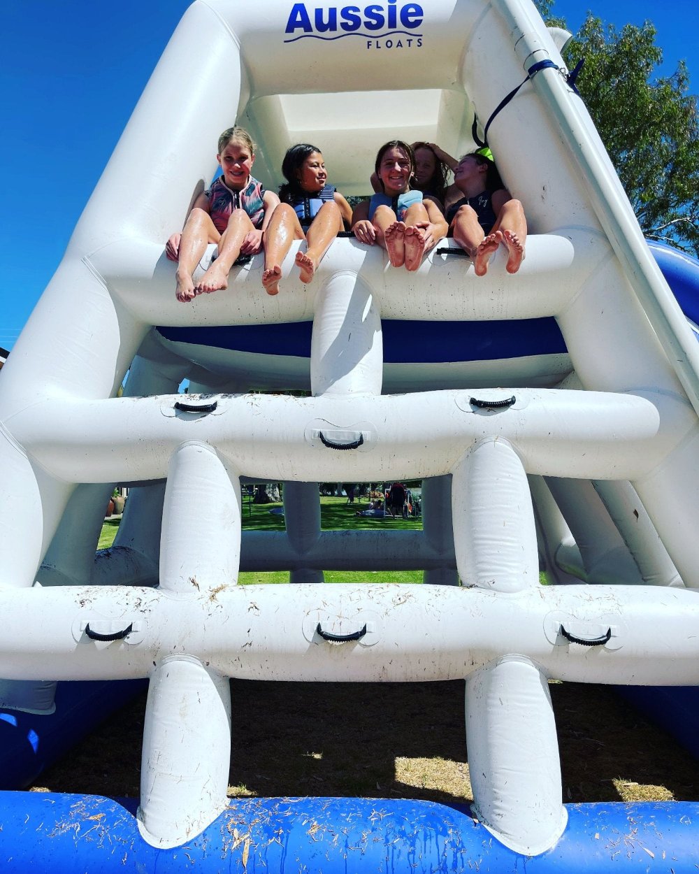 Kids playing on the Aussie Floats inflatable water slide