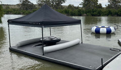People relaxing on an Aussie Floats inflatable houseboat deck extension