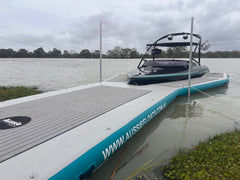 Aussie Floats Walk Up Series inflatable pontoon beside a ski boat