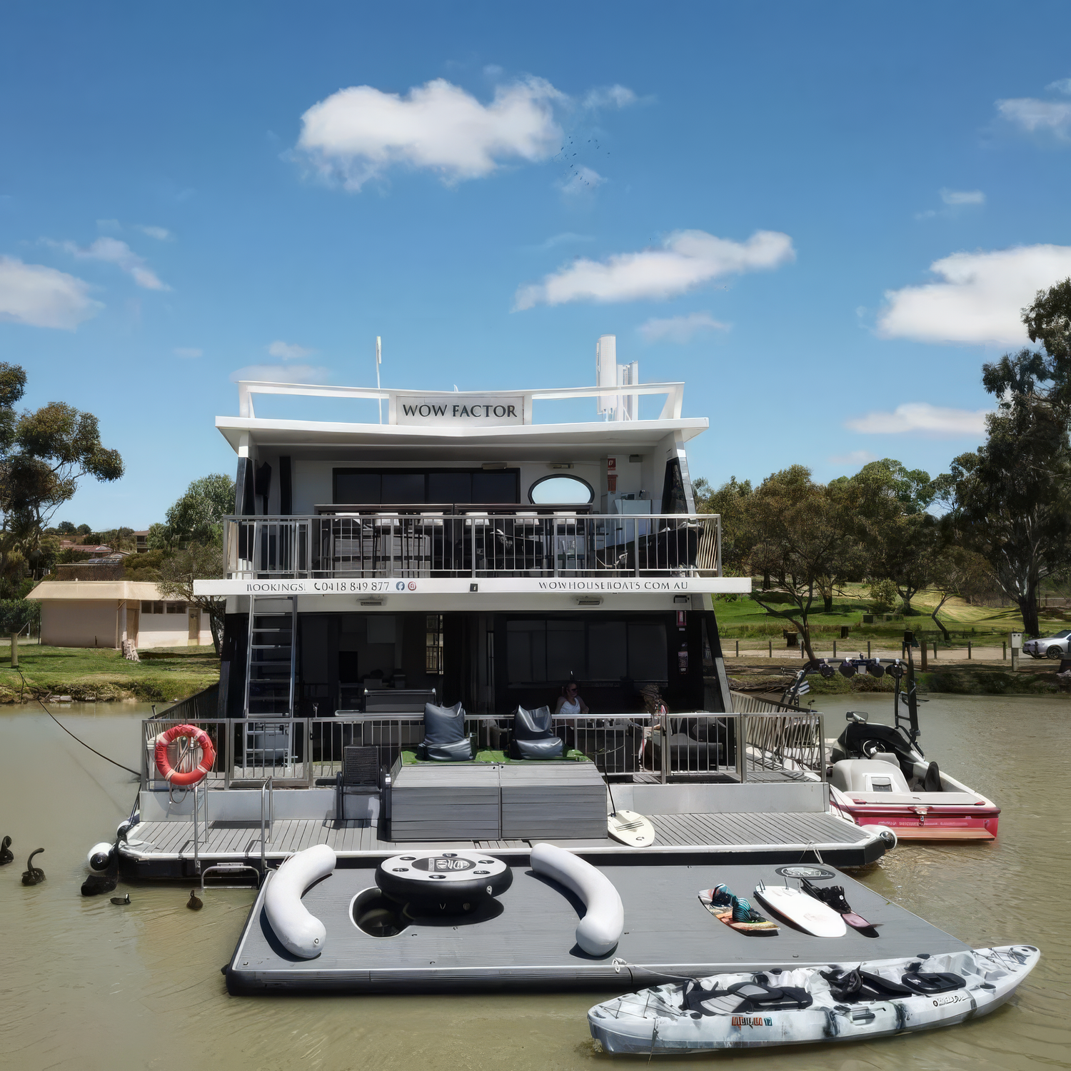 Inflatable back deck extension attached to a houseboat
